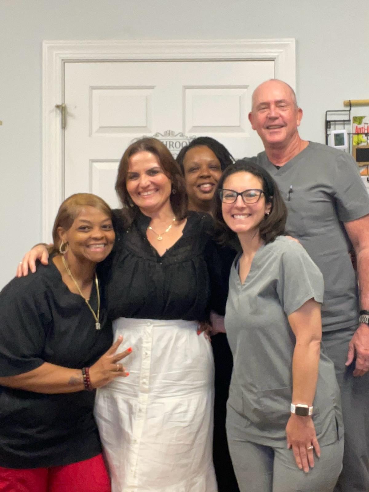 Tasha Maria Soto with a graduating cohort of students at Salud Natural Wellness & Learning Center